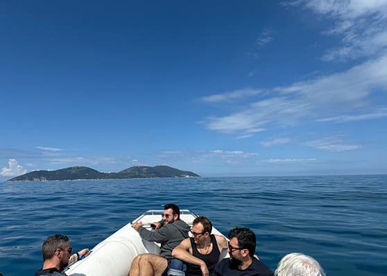 A group of people, going towards Sazan Island, during a boat trip Vlore in Sazan Island