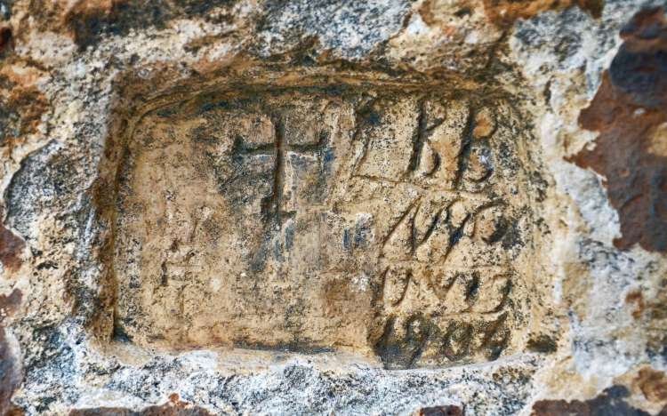 Grama Bay rock inscriptions